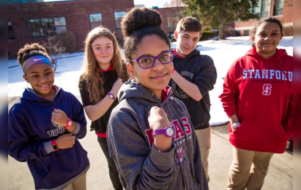 Children hold up wrists with wristbands that monitor chemical exposure: Leaders must come together to drive collective action for clean air solutions