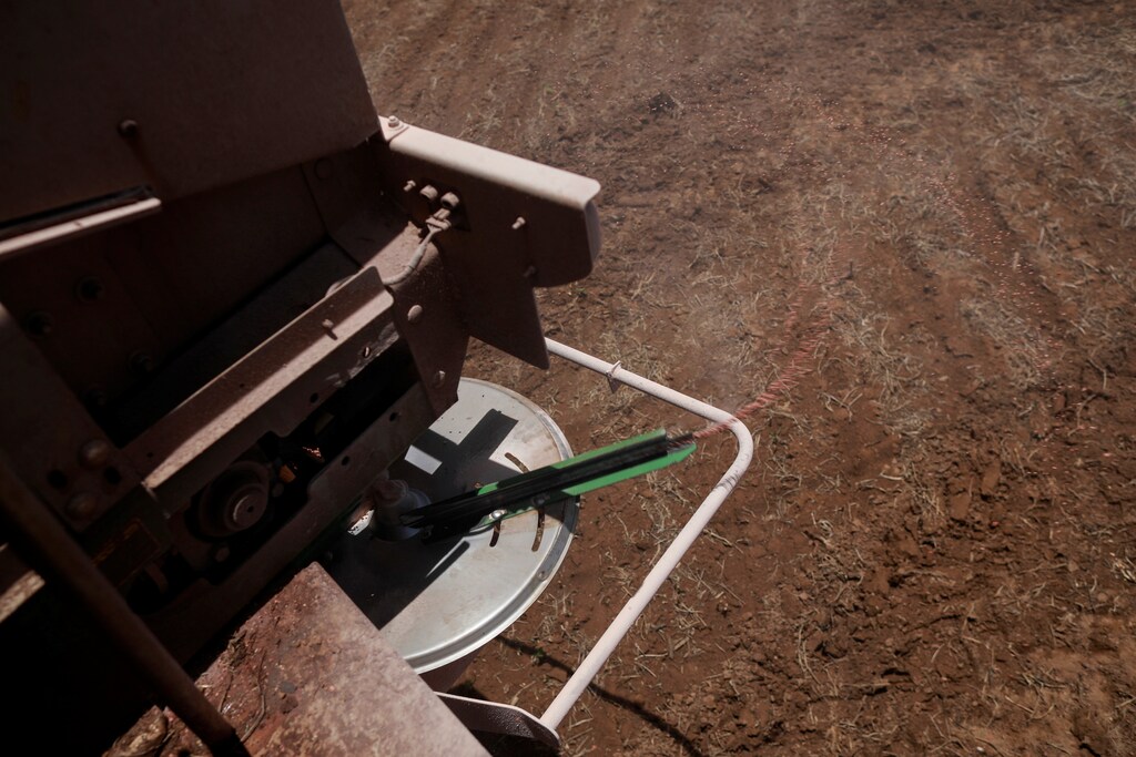 Fertilizer is seen in a tractor as it is being spread in a soybean field, near Brasilia, Brazil February 15, 2022. Picture taken February 15, 2022.REUTERS/Adriano Machado