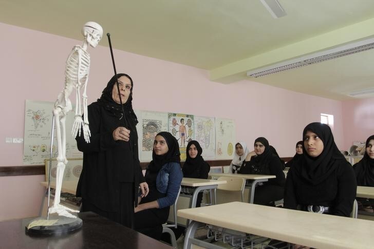 Students attend class in the Nafit 1, a modern school built with the aid of a grant from Kuwait, in Basra, southeast of Baghdad November 2, 2014. A country that used to have one of the finest education systems in the Middle East is struggling to provide school students with the basic opportunity to learn. In the southern port city of Basra, many school buildings are in a dilapidated state. Large numbers of children are attending schools that lack even basic water or sanitation facilities, have crumbling walls, broken windows and leaking roofs. To help Iraq cope with the schools crisis, neighbouring Kuwait granted more than US2 million dollars (2.4 billion Iraqi dinars) in aid in building 10 schools across Iraq, including four schools in Basra. Picture taken November 2, 2014. REUTERS/Essam Al-Sudani (IRAQ - Tags: BUSINESS POLITICS EDUCATION)