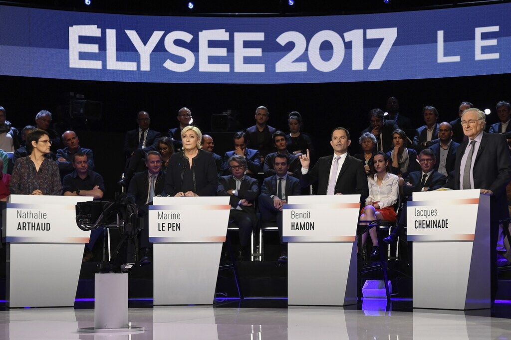 Candidates attend a prime-time televised debate for the French 2017 presidential election in La Plaine Saint-Denis, near Paris, France, April 4, 2017. L to R: Nathalie Arthaud of France's extreme-left Lutte Ouvriere party (LO), Marine Le Pen of French National Front (FN), Benoit Hamon of the French Socialist party and Jacques Cheminade. REUTERS/Lionel Bonaventure/Pool - RTX343RL