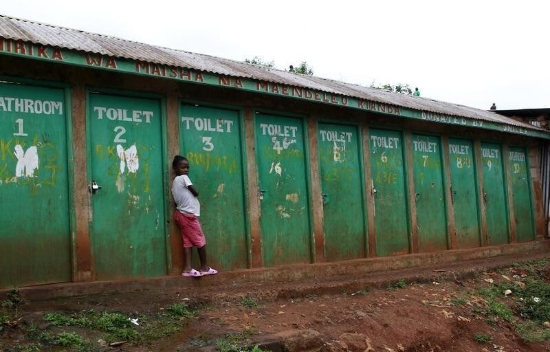 A girl waits to use a public toilet in the sprawling Kibera slum, one of the largest and poorest slums in Africa and home to about 1 million people in Kenya’s capital Nairobi August 26, 2011.