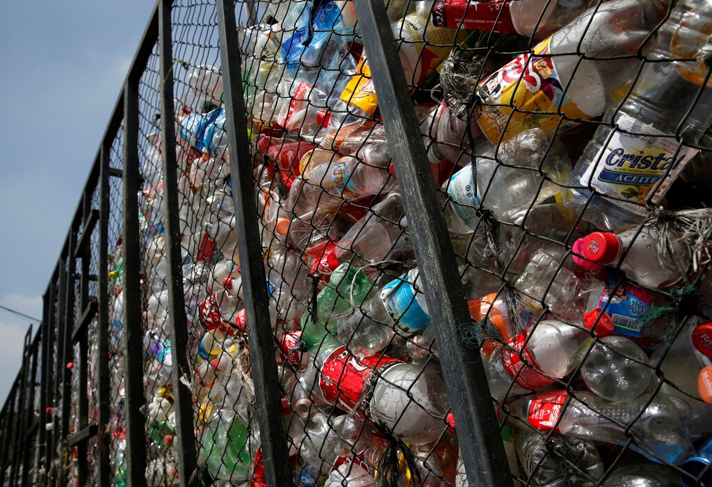 Recyclable plastic soft drink bottles are seen outside at a recycling warehouse, in Mexico City, Mexico August 18, 2017. REUTERS/Henry Romero - RC174A5CFA60