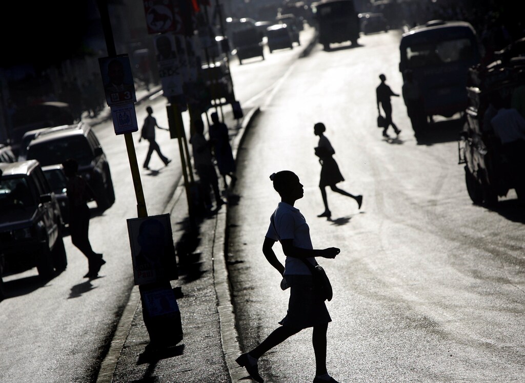 A Haitian woman crosses a street of Port-au-Prince February 1, 2006.