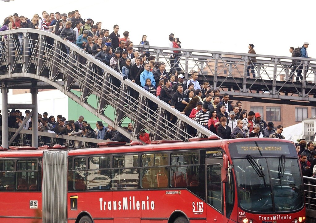 Passengers wait for a Transmilenio system bus during rush hour in Bogota, March 12, 2014. A Thomson Reuters Foundation survey of 15 of the world's largest capitals and New York found Bogota in Colombia ranked as having the most unsafe public transport, with women scared to travel after dark, followed by Mexico City, Lima, then Delhi. Picture taken March 12, 2014. To match Thomson Reuters Foundation story WOMEN/POLL REUTERS/Jose Miguel Gomez (COLOMBIA - Tags: SOCIETY TRANSPORT TPX IMAGES OF THE DAY) - RTR4BYP4