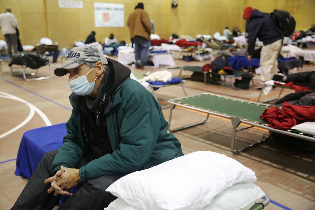 Sid Snow, 72, stays overnight at the Salvation Army facility after winter weather caused electricity blackouts in Plano, Texas, U.S. February 18, 2021. After traveling 4 hours to visit his son in North Texas, the hotel he stayed at lost power, leaving him to seek refuge at the Salvation Army for several nights.