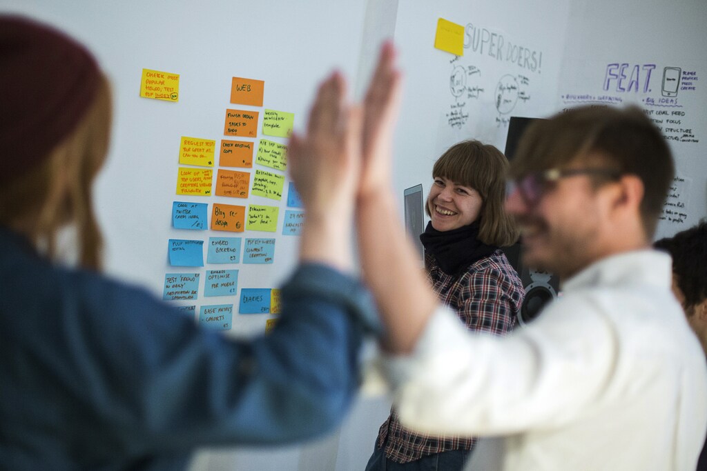 Emma Rose of Britain and Sweden's Nils Westerlund and Sofia Braendstroem (L-R) of the HowDo start-up attend a production meeting at their office at the Wostel co-working space in Berlin March 18, 2013. Europe must urgently tackle youth unemployment, the French, German and Italian governments said May 28, 2013, urging action to rescue an entire generation who fear they will not find jobs. Some 7.5 million Europeans aged 15-24 are neither in employment nor in education or training, according to EU data. Youth unemployment in the EU stood at 23.6 percent in January, more than twice as high as the adult rate. Picture taken March 18, 2013. REUTERS/Thomas Peter (GERMANY - Tags: BUSINESS EMPLOYMENT) - RTX103SD