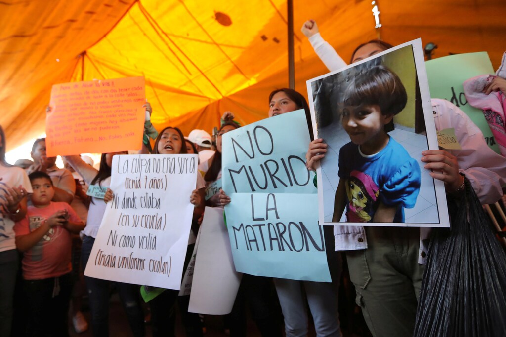 Activists hold placards at the home of Fatima Cecilia Aldrighett, 7, who went missing on February 11 and whose body was discovered over the weekend inside a plastic garbage bag, in Mexico City, Mexico, February 17, 2020. REUTERS/Edgard Garrido - RC2P2F96GQK1
