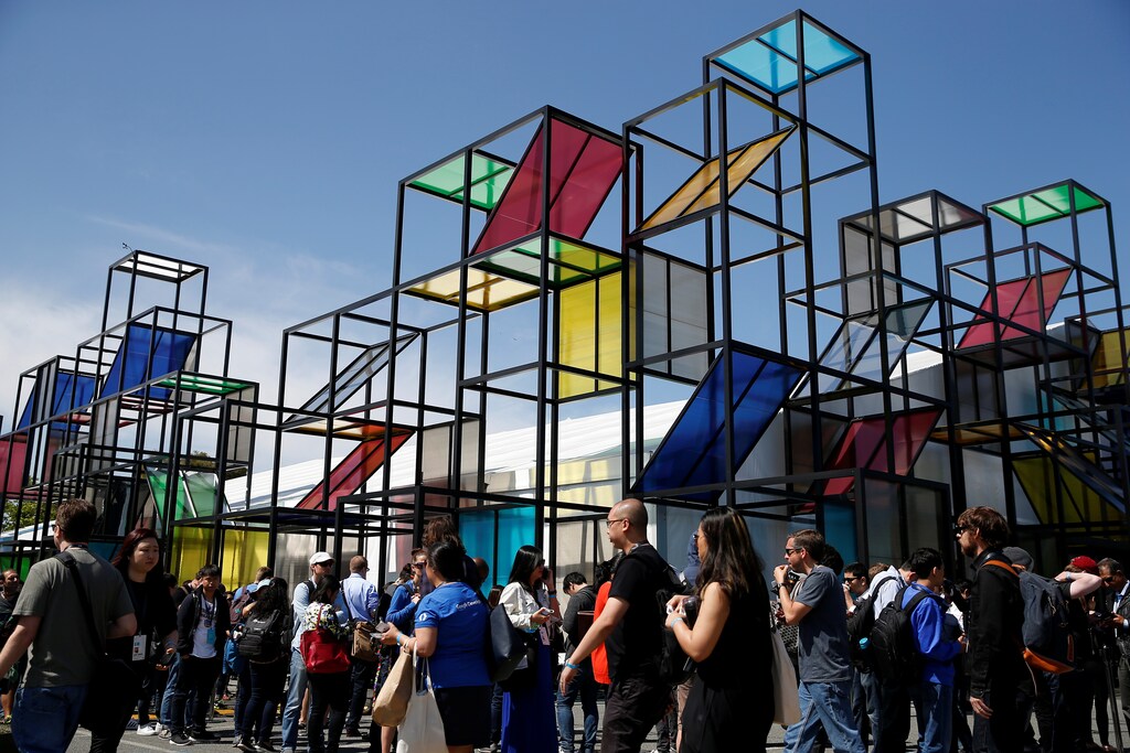 Attendees stand in front of a sculpture during the Google I/O 2016 developers conference in Mountain View, California May 19, 2016. REUTERS/Stephen Lam - RTSF2C7