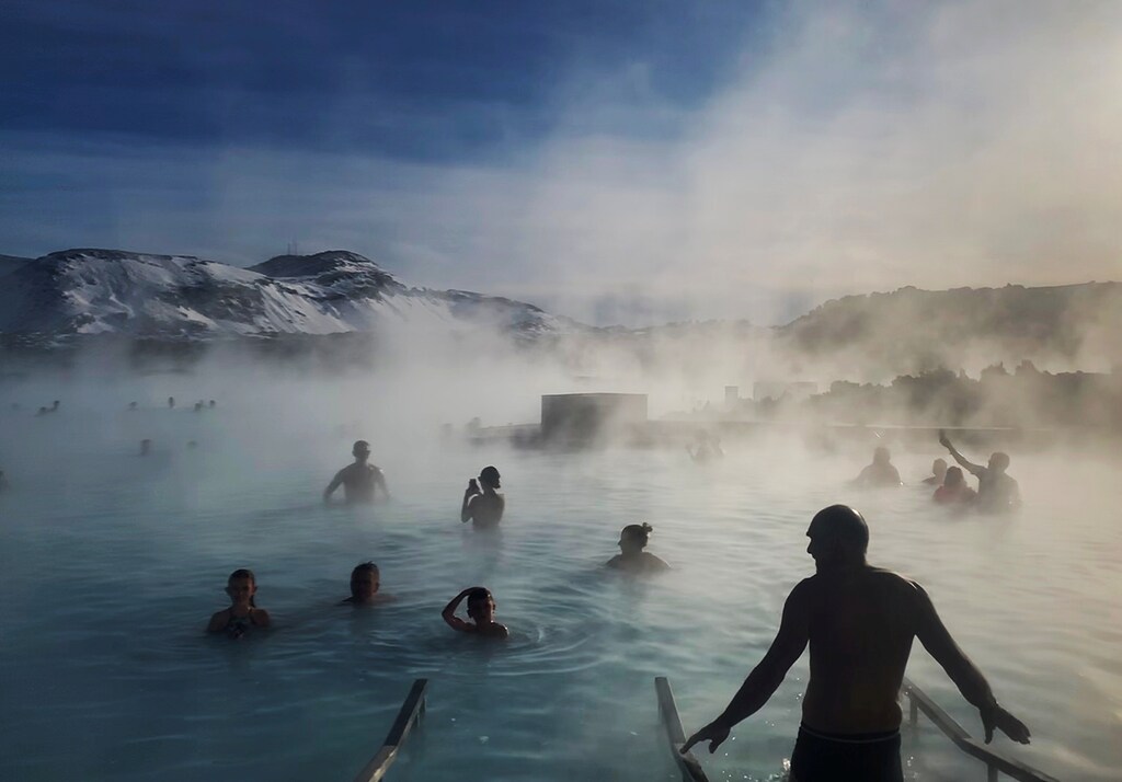 Bathers enjoy the warm volcanic hot springs of the Blue Lagoon in Grindavik, Iceland, March 6, 2020. REUTERS/Hannah McKay TPX IMAGES OF THE DAY - RC2KEF99UT8I