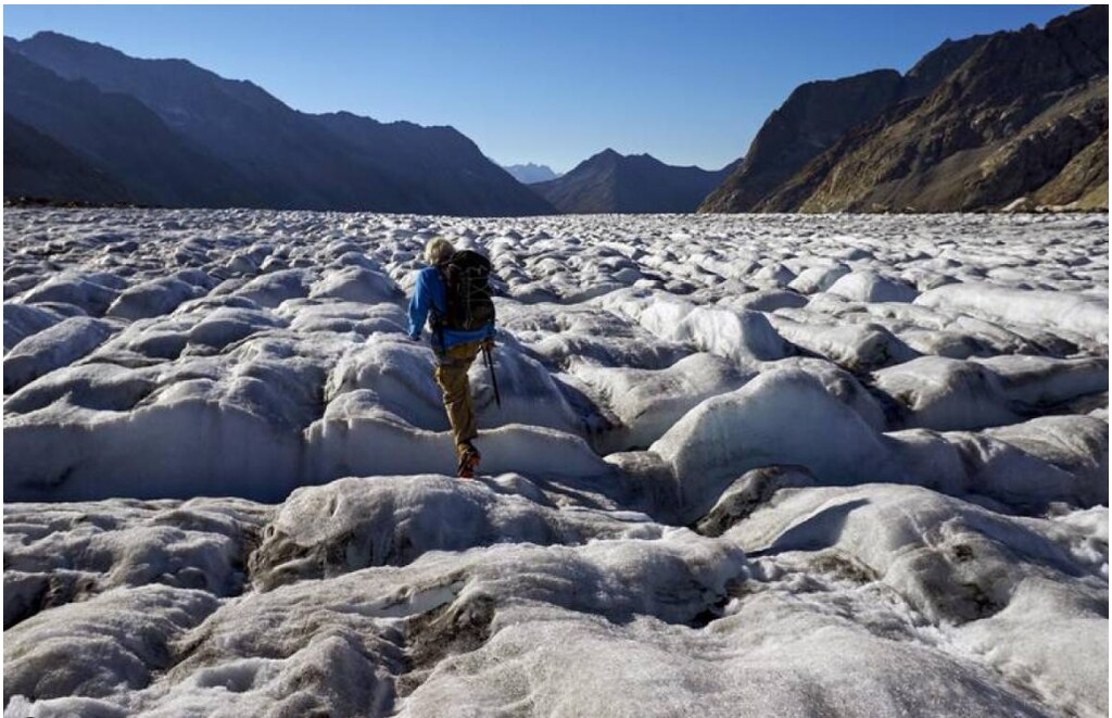 Mountain guide Christian Pletscher walks on the Aletsch Glacier, Switzerland, August 29, 2015.