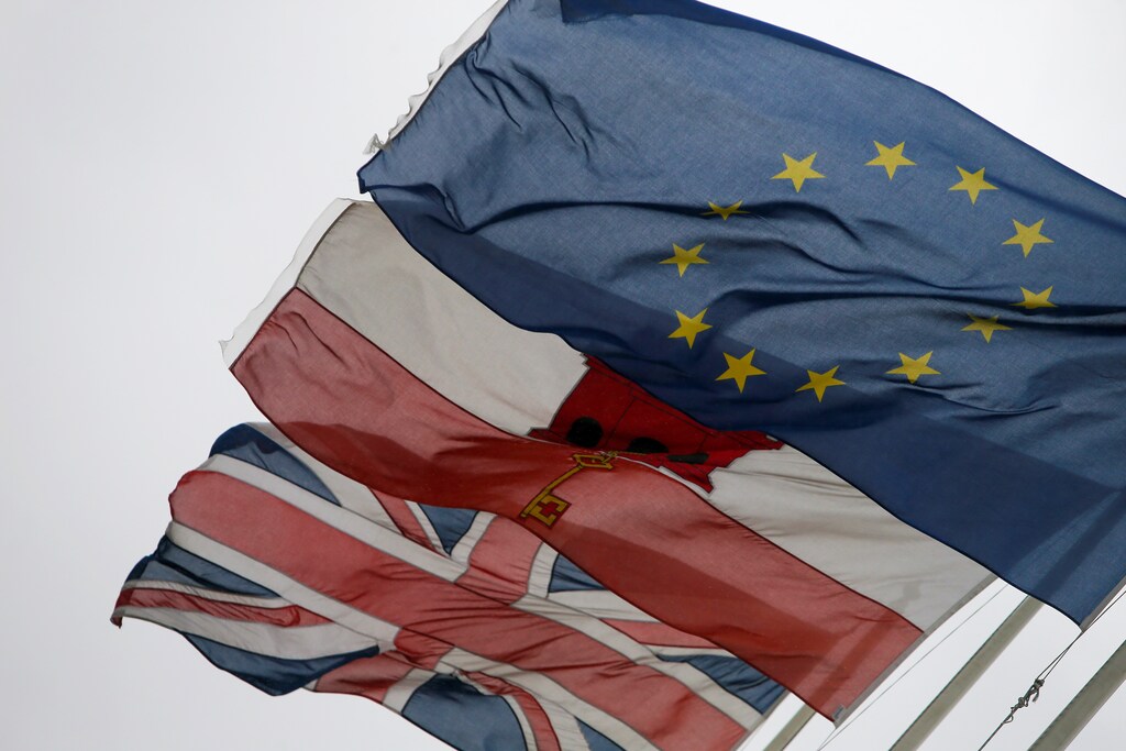 The European Union flag flies alongside the Gibraltarian flag and Britain's Union Jack in the British overseas territory of Gibraltar, historically claimed by Spain, November 22, 2018. REUTERS/Jon Nazca - RC1E3265D290