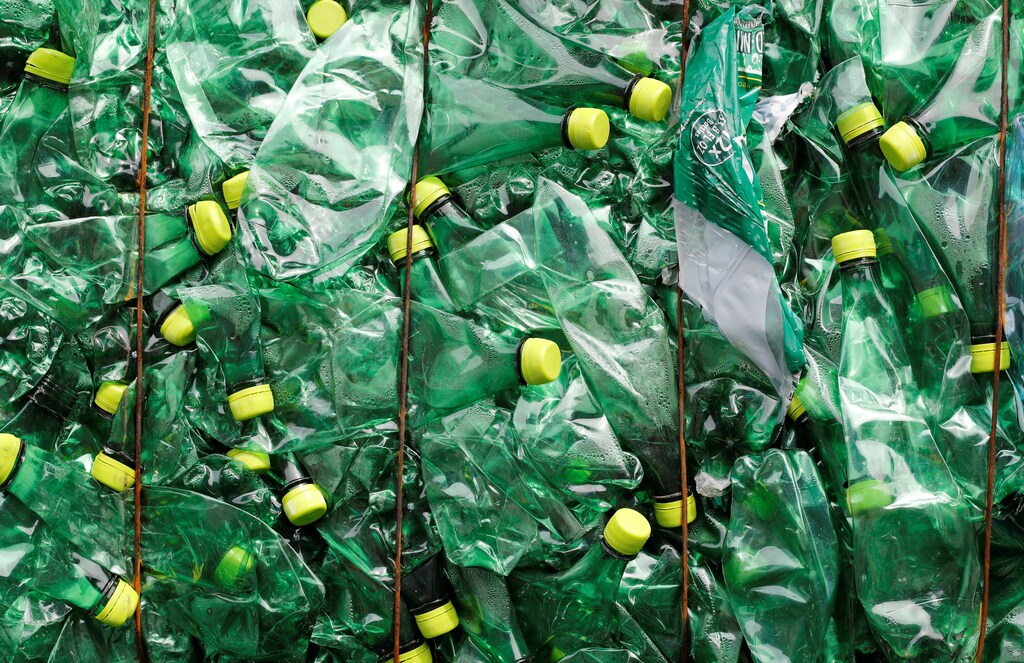 A bundle of pressed bottles made from PET (polyethylene terephthalate) plastic is stored at Poly Recycling AG company in Bilten, Switzerland April 3, 2019. REUTERS/Arnd Wiegmann - RC18BC780C60