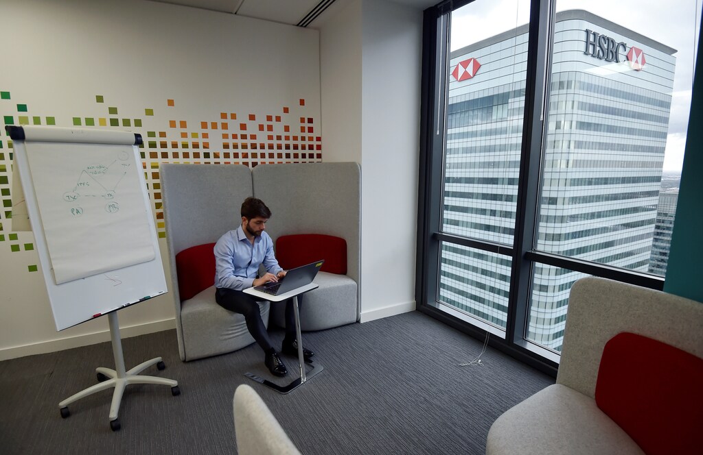 A UBS employee works in the UBS "fintech lab" at Canary Wharf in London, Britain, October 19, 2016. REUTERS/Hannah McKay - RTX2PJIZ