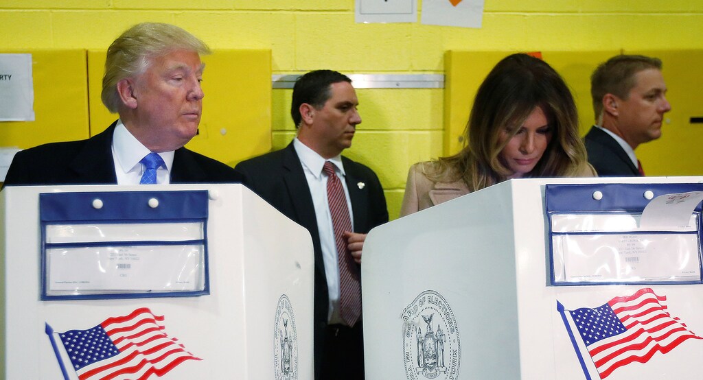 Republican presidential nominee Donald Trump and his wife Melania Trump vote at PS 59 in New York, New York, U.S. November 8, 2016. REUTERS/Carlo Allegri - RTX2SKR2