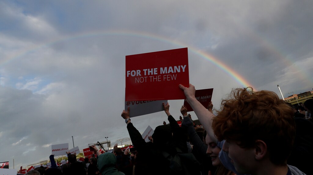 A rainbow appears above the stage as Jeremy Corbyn, leader of Britain's opposition Labour Party, speaks at a campaign rally in Birmingham, Britain June 6, 2017. REUTERS/Darren Staples - RTX39BX1
