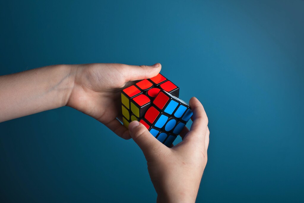 a picture of a puzzle box cube symbolic of someone problem solving