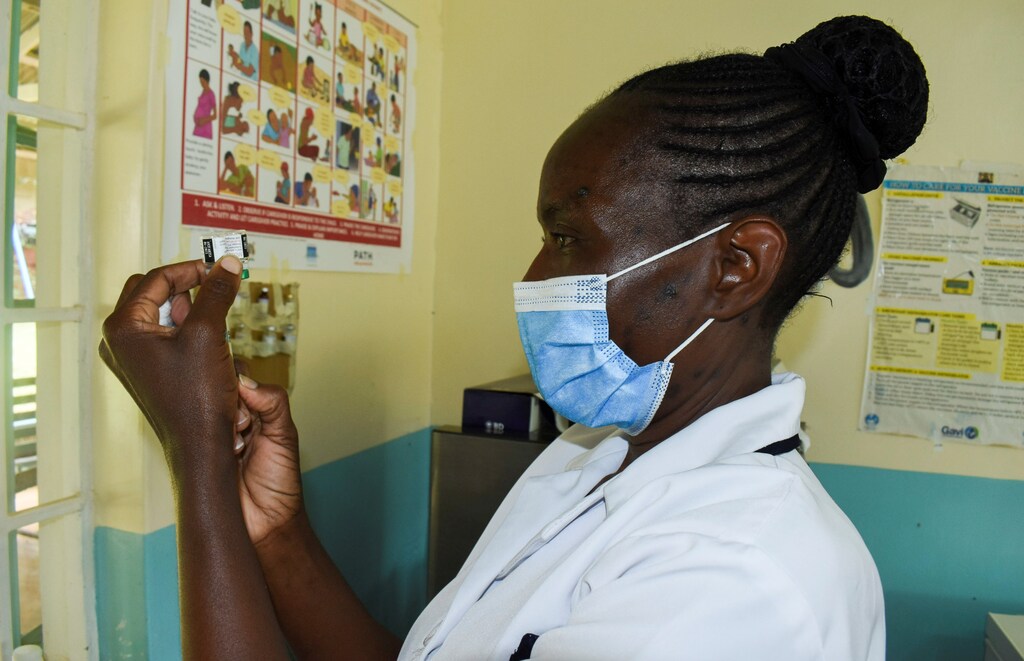 Pamela Omboko, a nurse, prepares a vaccine against Malaria for infants at the Yala Sub County Hospital Mother and Child Healthcare (MCH) clinic in Gem, Siaya County, Kenya.