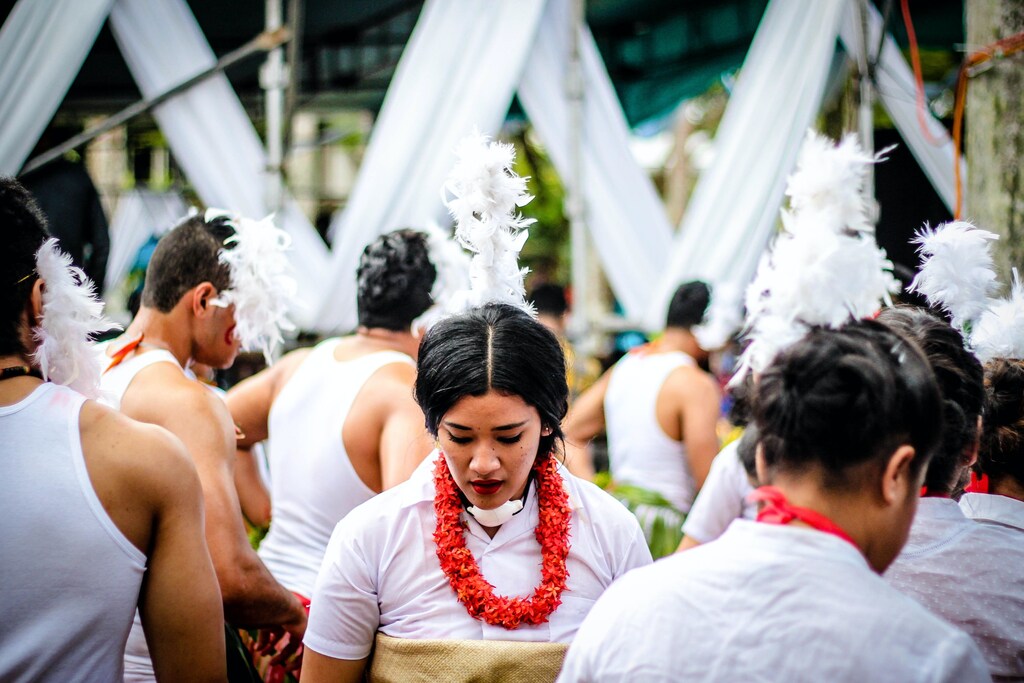 Members of a pacific nation attend a celebration in traditional dress.