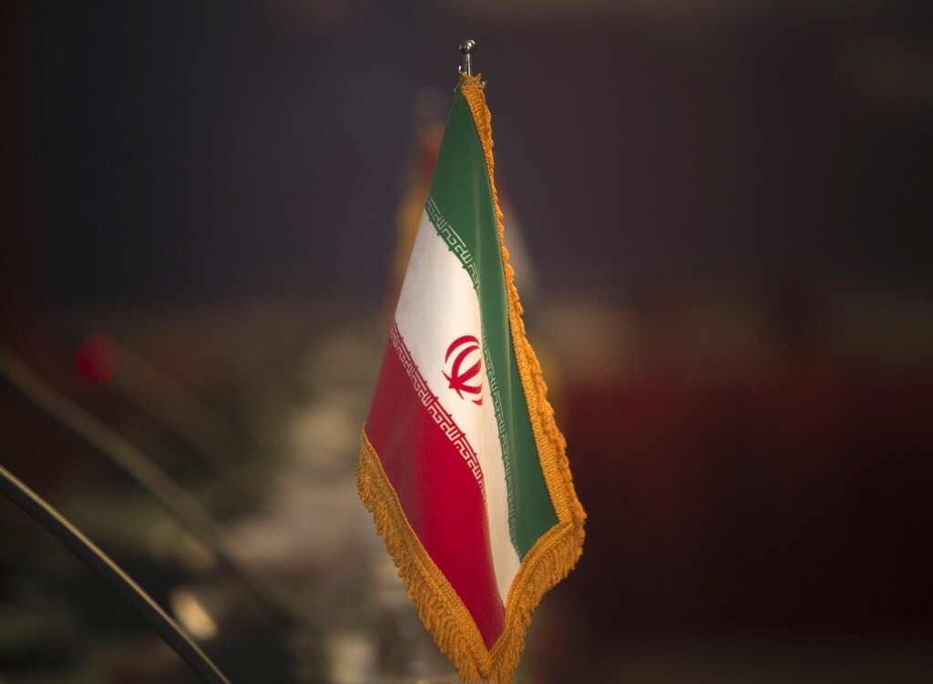 Reuters and other foreign media are subject to Iranian restrictions on leaving the office to report, film or take pictures in Tehran. The Iranian flag is pictured before the opening of the 32nd Meeting of the Ministers of Foreign Affairs of G-15, at a Foreign ministry building in northern Tehran May 15, 2010. REUTERS/Morteza Nikoubazl (IRAN - Tags: POLITICS ENERGY) - RTR2DWLF