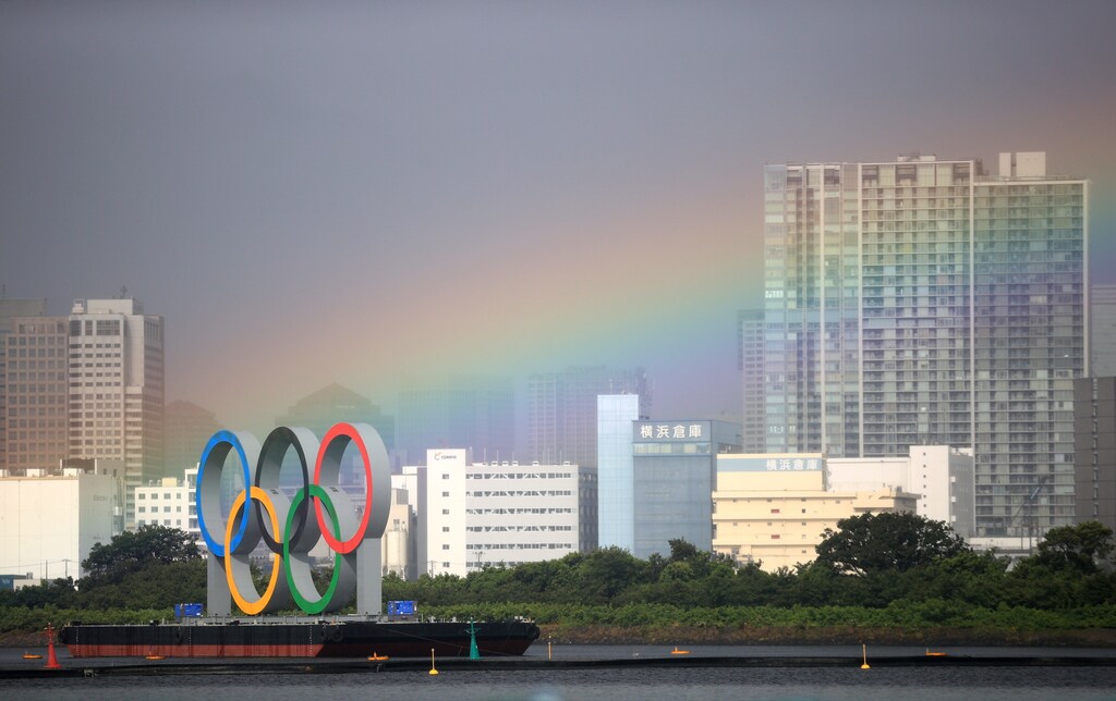 Tokyo 2020 Olympics - Triathlon - Women's Olympic Distance - Final - Odaiba Marine Park, Tokyo, Japan July 27, 2021. A rainbow over city is seen during competition. REUTERS/Hannah Mckay/File Photo SEARCH "OLYMPICS DAY 5" FOR TOKYO 2020 OLYMPICS EDITOR'S CHOICE, SEARCH "REUTERS OLYMPICS TOPIX" FOR ALL EDITOR'S CHOICE PICTURES - RC25TO97XK47