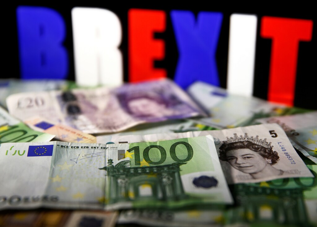 Euro and Pound banknotes are seen in front of BREXIT letters in this picture illustration taken April 28, 2017. REUTERS/Dado Ruvic/Illustration - RTS148YC