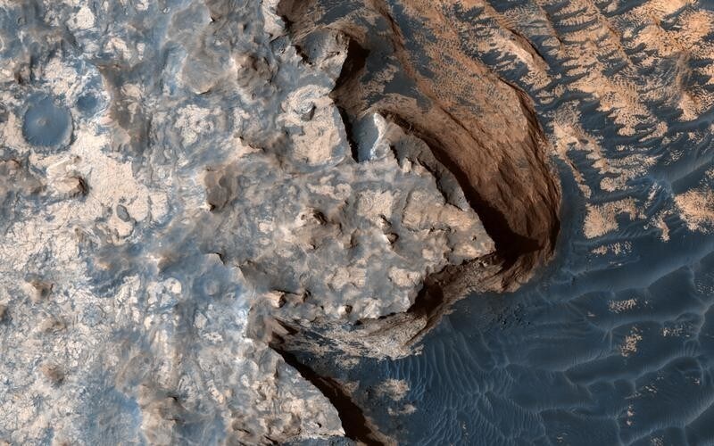 An image acquired by the High Resolution Imaging Science Experiment (HiRISE) camera aboard NASA's Mars Reconnaissance Orbiter on April 18, 2017, shows a rugged cliff edge. Image released June 22, 2017.
