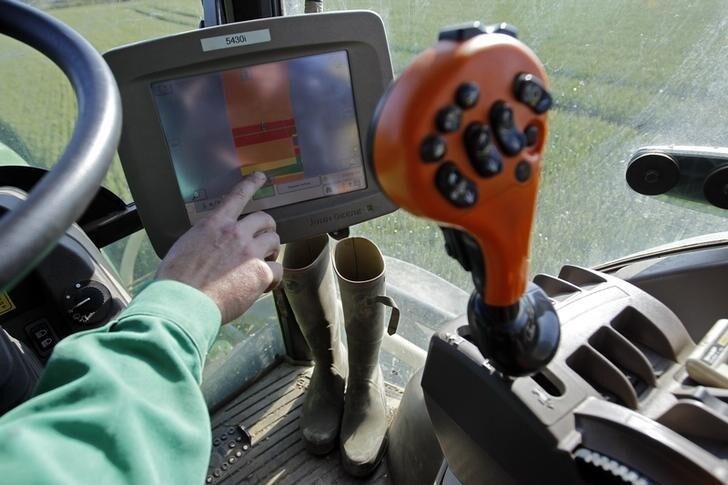 A French farmer uses his GPS screen which displays a colour representation of a wheat field following the treatment using satellite-generated data in Chateaubriant May 29, 2012. REUTERS/Stephane Mahe (FRANCE - Tags: AGRICULTURE BUSINESS ENVIRONMENT SCIENCE TECHNOLOGY)