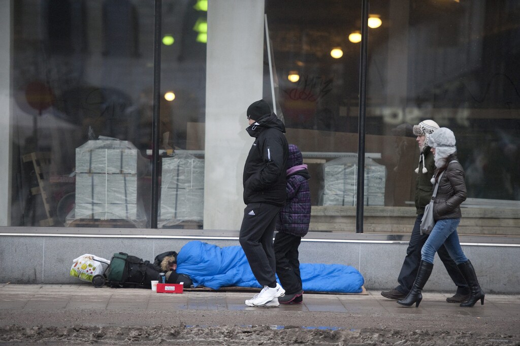 A homeless man sleeps on the street in Stockholm in this February 18, 2012 file photo. In a 15-year span, Sweden has seen the steepest increase in inequality of all countries in the developed world, with disparities rising at a pace four times that of the United States, albeit from a low level, according to OECD data. To match Feature SWEDEN-INEQUALITY/ REUTERS/Leif R Jansson/Scanpix Sweden (SWEDEN - Tags: BUSINESS SOCIETY POVERTY) THIS IMAGE HAS BEEN SUPPLIED BY A THIRD PARTY. IT IS DISTRIBUTED, EXACTLY AS RECEIVED BY REUTERS, AS A SERVICE TO CLIENTS. NO COMMERCIAL OR BOOK SALES. SWEDEN OUT. NO COMMERCIAL OR EDITORIAL SALES IN SWEDEN. NO THIRD PARTY SALES. NOT FOR USE BY REUTERS THIRD PARTY DISTRIBUTORS - GM1E83L1RVQ01