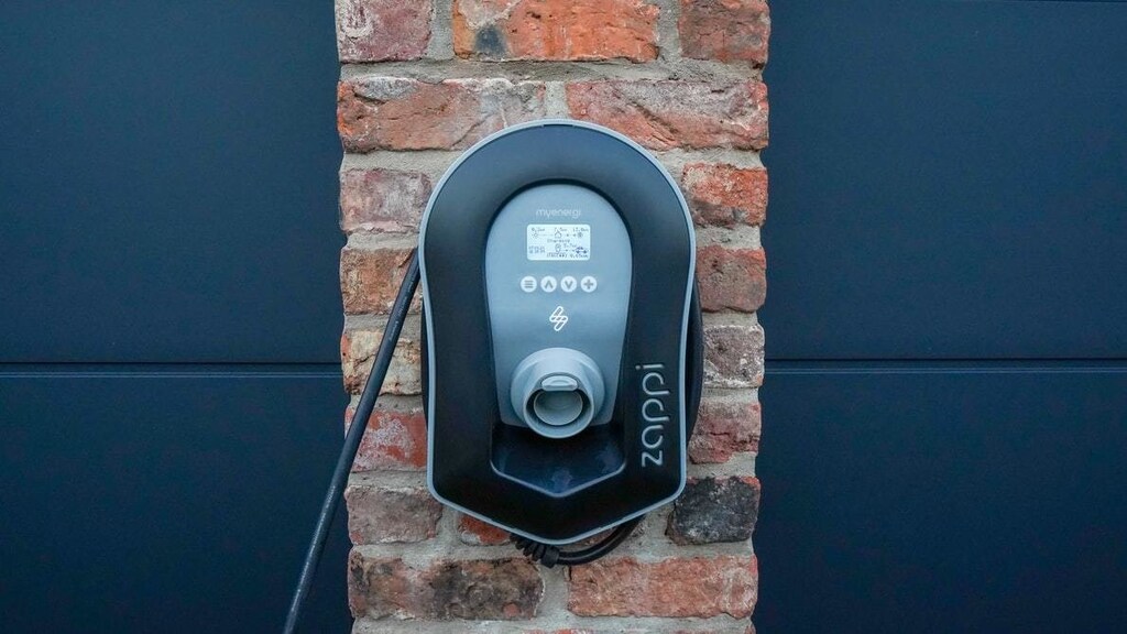 An EV charging station positioned on the side of a house.