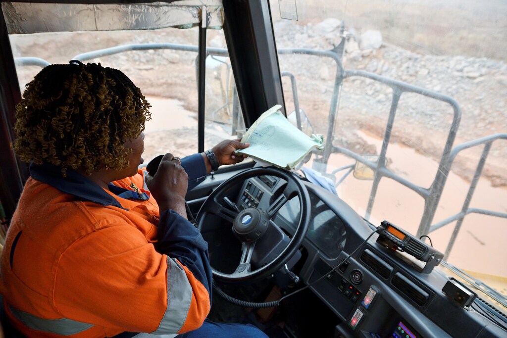 Tene Konate, 42, a truck driver, talks on a radio as she sits in her truck at the gold mine site, operated by Endeavour Mining Corporation in Hounde, Burkina Faso February 10, 2020. Picture taken February 10, 2020.