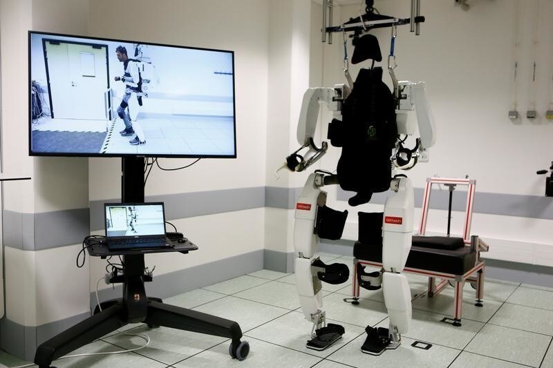 The pioneering four-limb robotic system, or exoskeleton, that is commanded and controlled by signals from the patient's brain is seen following a news conference after Thibault, a 28-year-old man, paralyzed from the shoulders down, had been able to walk using it at the French research center Clinatec in Grenoble, France, October 7, 2019. REUTERS/Emmanuel Foudrot - RC1EFC28DE30