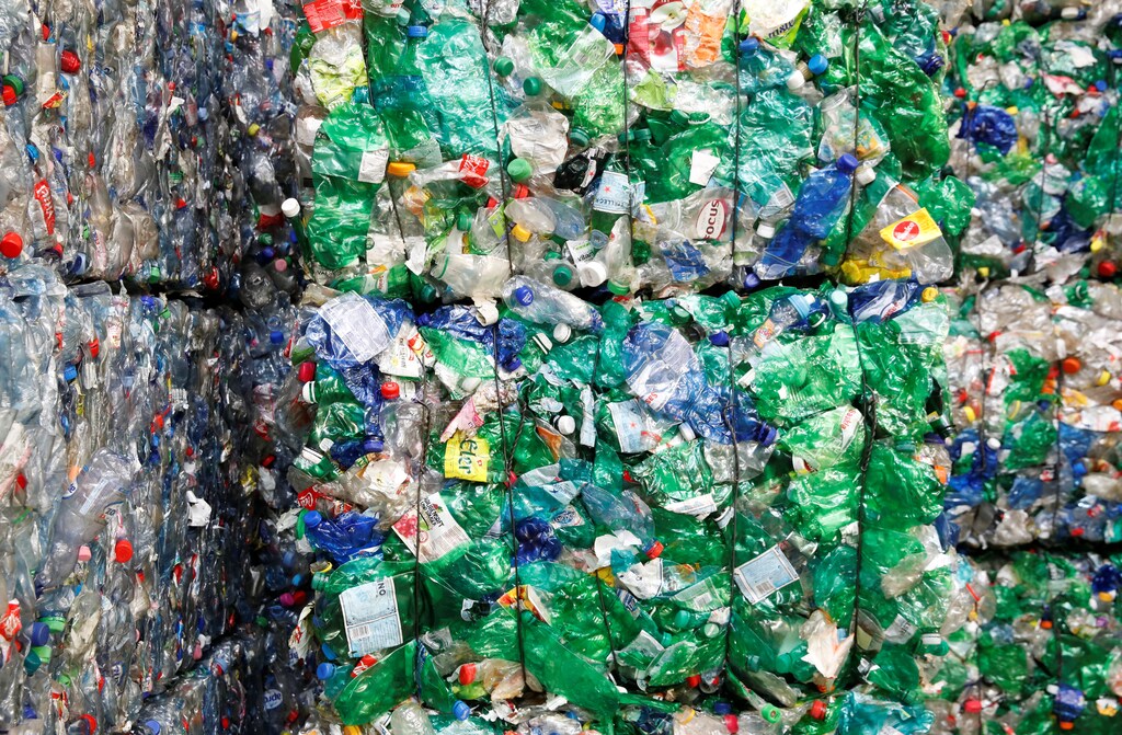 Bundles of pressed PET (polyethylene terephthalate) bottles made out of plastic are seen at the Transcycle Transport & Recycling AG company in Neuenhof, Switzerland November 22, 2018. Picture taken November 22, 2018. REUTERS/Arnd Wiegmann - RC11F538D6C0