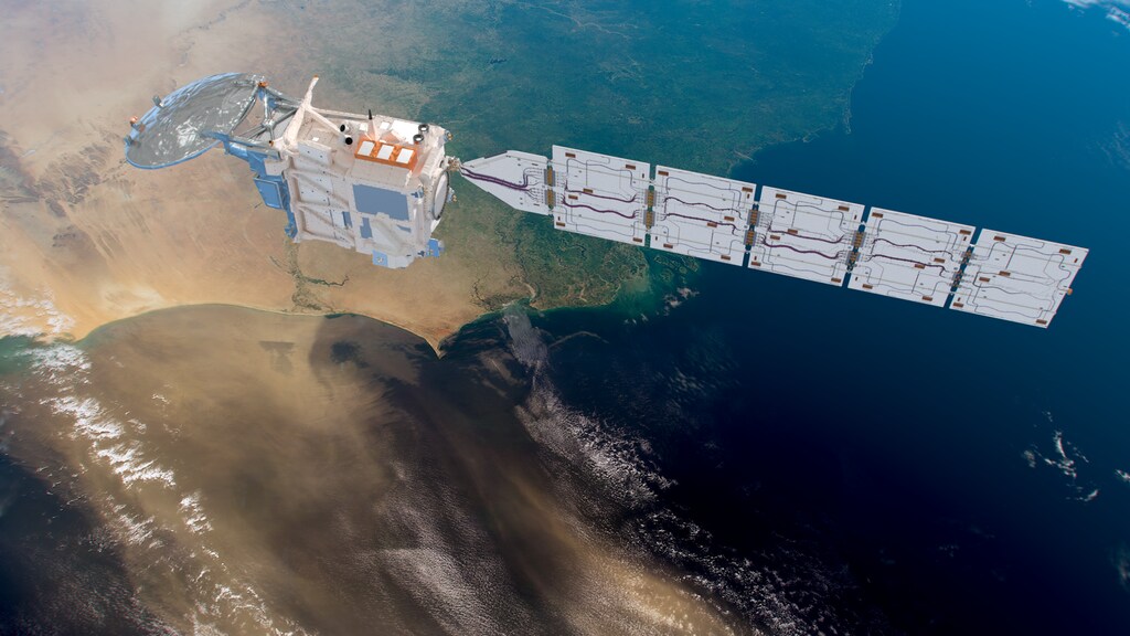 Earth observation satellite above Earth observing desert dust