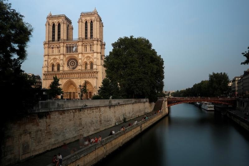 A general view shows the Notre Dame Cathedral on the edge of the Seine river in Paris, France, August 28, 2017. Officials at the 854-year old Notre-Dame cathedral, France's most-visited monument, say it is in urgent need of raising 100 million euros ($120.40 million) to repair everything from damaged arches and statutes to broken down gargoyles. Picture taken with long time exposure. REUTERS/Philippe Wojazer - RC12E5715CE0