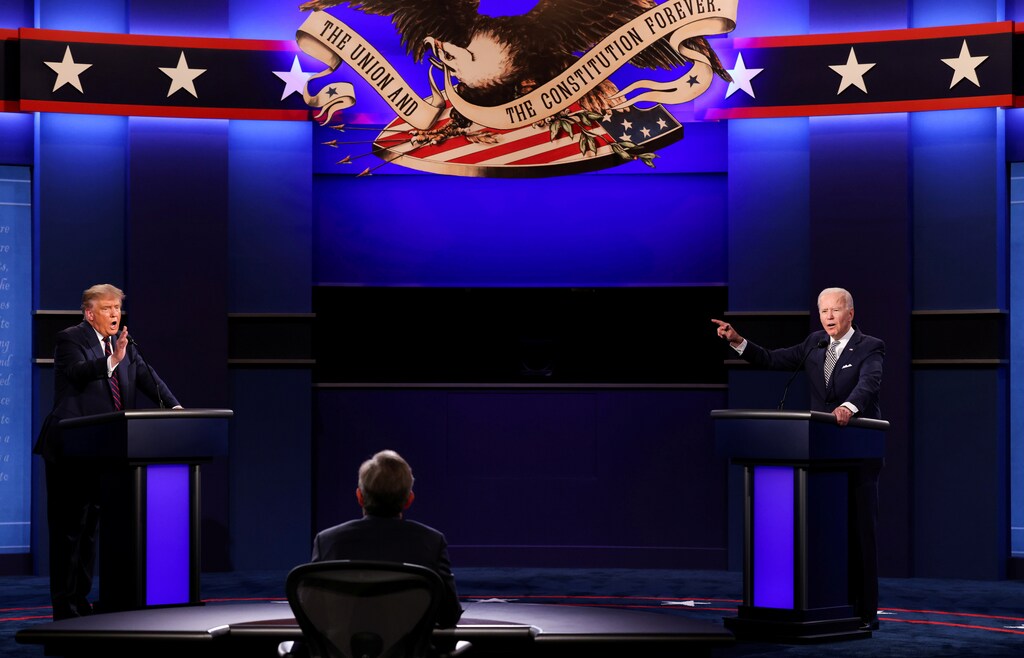 U.S. President Donald Trump and Democratic presidential nominee Joe Biden participate in their first 2020 presidential campaign debate held on the campus of the Cleveland Clinic at Case Western Reserve University in Cleveland, Ohio, U.S., September 29, 2020. REUTERS/Jonathan Ernst TPX IMAGES OF THE DAY - RC2Q8J9FXNME