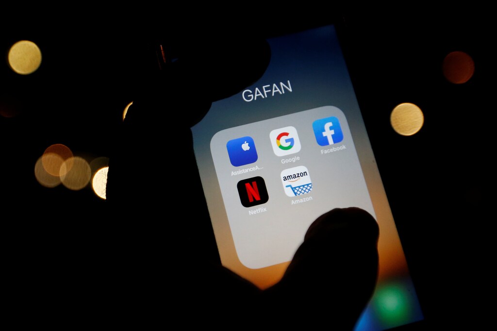 The logos of mobile apps, Google, Amazon, Facebook, Apple and Netflix, are displayed on a screen in this illustration picture taken December 3, 2019.