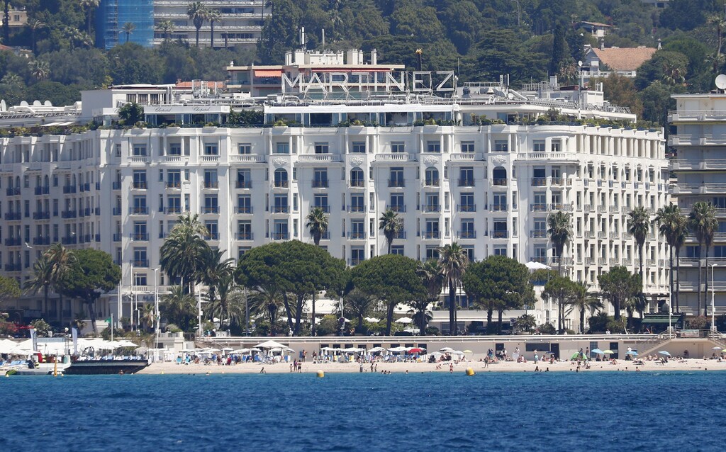The 74th Cannes Film Festival - The Croisette - Cannes, France, July 5, 2021. A general view shows the Croisette with beaches and the Hotel Martinez before the start of the Cannes Film Festival.