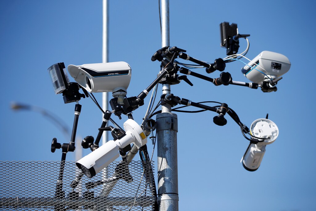 Surveillance cameras on a security fence in Quebec, Canada.