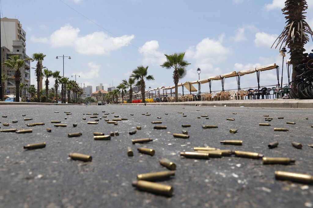 Bullet casings are seen on a street, during clashes with gunmen of hardline Sunni Muslim cleric Sheikh Ahmed al-Assir, in Sidon, southern Lebanon, June 24, 2013.