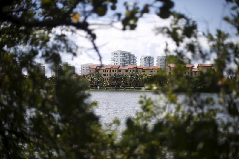 Buildings are seen near lake Nichupte in Cancun, October 14, 2015. Cancun's transformation in the 1970s from a small Caribbean fishing village into a strip of nightclubs and high-rise hotels has reduced biodiversity and polluted water resources as infrastructure struggles to keep up. REUTERS/Edgard Garrido - GF20000084237