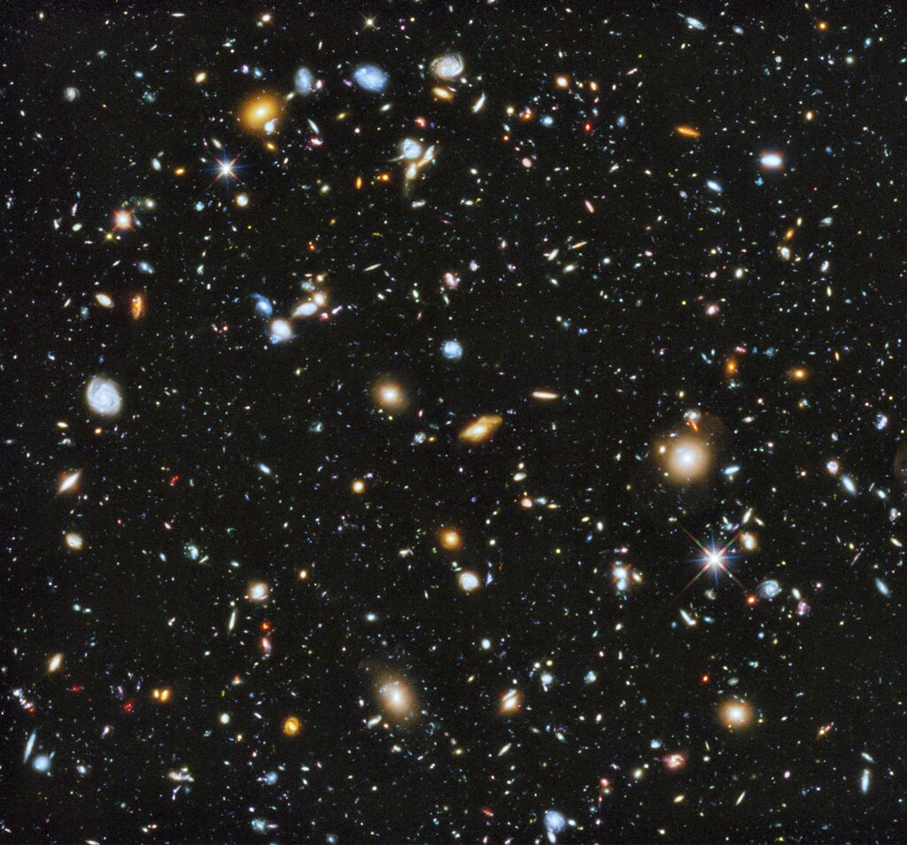A composite of separate exposures taken in 2003 to 2012 with Hubble's Advanced Camera for Surveys and Wide Field Camera 3 of the evolving universe is shown in this handout photo provided by NASA, June 3, 2014. Researchers say the image, from a new study called the Ultraviolet Coverage of the Hubble Ultra Deep Field, provides the missing link in star formation. Made from 841 orbits of telescope viewing time, it contains approximately 10, 000 galaxies, extending back in time to within a few hundred million years of the big bang, according to NASA. REUTERS/HUDF/NASA/Handout via Reuters (OUTERSPACE - Tags: SCIENCE TECHNOLOGY) ATTENTION EDITORS - FOR EDITORIAL USE ONLY. NOT FOR SALE FOR MARKETING OR ADVERTISING CAMPAIGNS. THIS IMAGE HAS BEEN SUPPLIED BY A THIRD PARTY. IT IS DISTRIBUTED, EXACTLY AS RECEIVED BY REUTERS, AS A SERVICE TO CLIENTS - RTR3S21L
