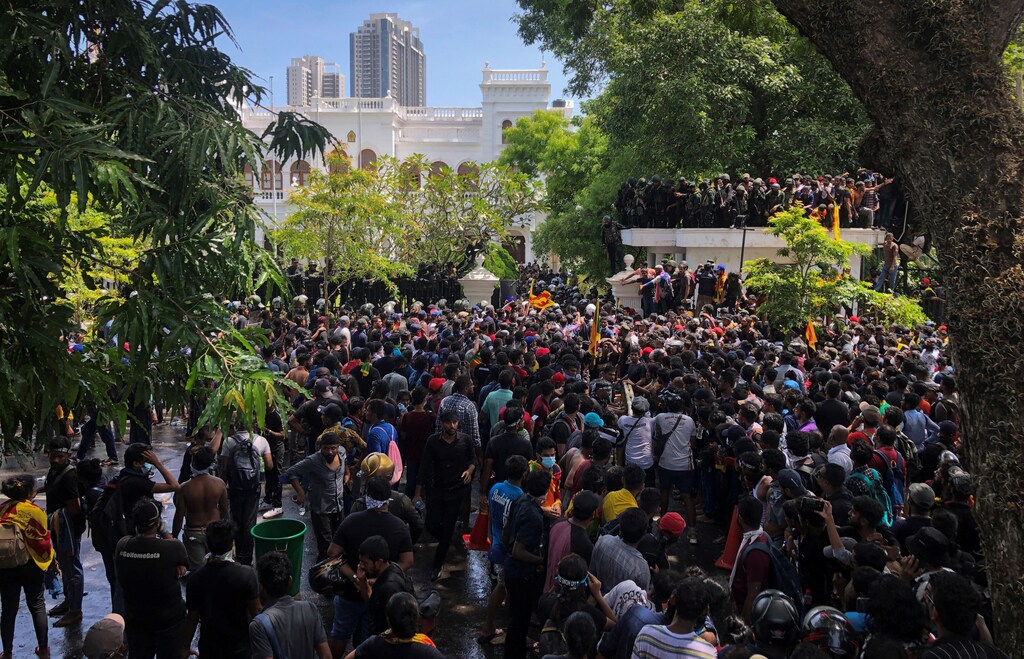 Demonstrators gather outside their Prime Minister's office, amid Sri Lanka's economic crisis.