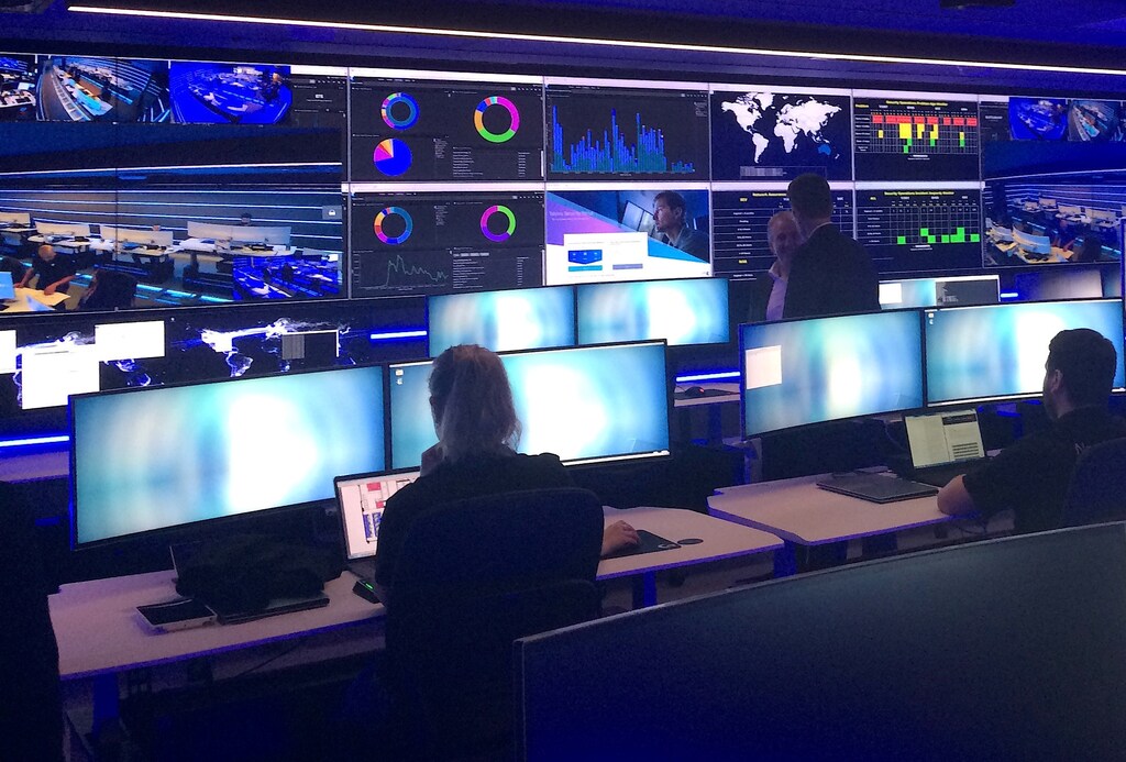 Employees can be seen in the Security Operation Centre for Telstra, Australia's biggest telecoms firm, which is used to monitor, detect and respond to security incidents, including cyber attacks, during a media event in central Sydney, Australia, August 24, 2017. REUTERS/Tom Westbrook - RC13805C7970