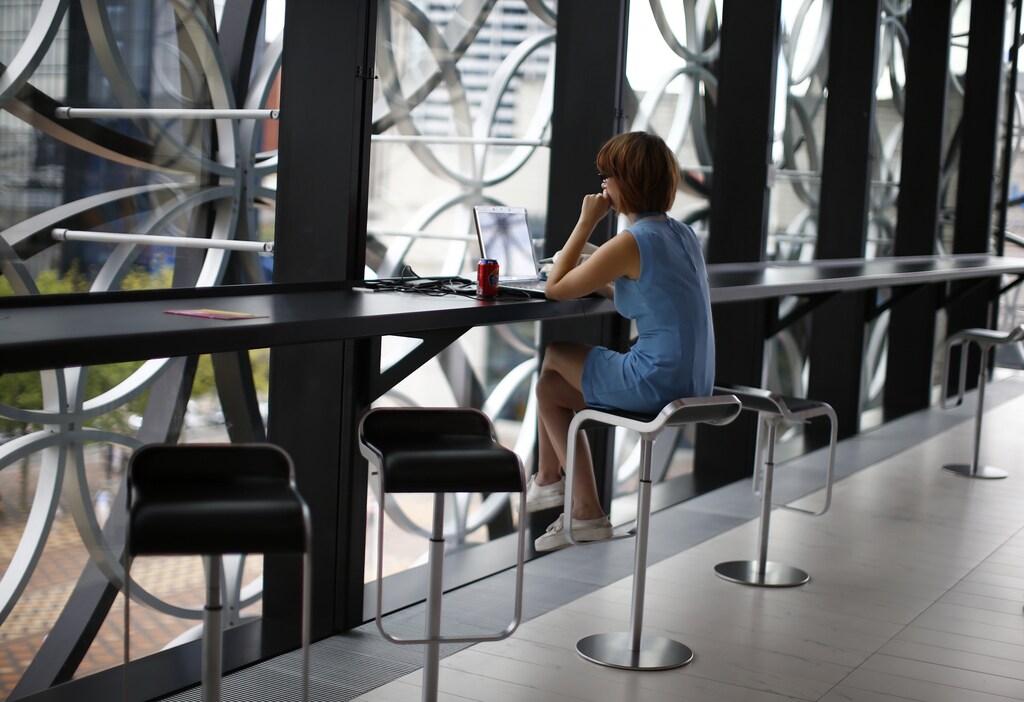 A woman uses a laptop after the opening of Birmingham Library in central England September 3, 2013. REUTERS/Darren Staples (BRITAIN - Tags: EDUCATION SOCIETY SCIENCE TECHNOLOGY) - LM1E993152101