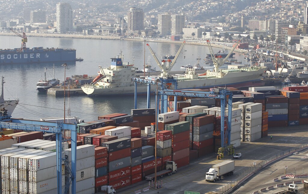 An unladen container ship is pictured among containers during a strike by port workers against the government in Valparaiso port, about 121 km (75 miles) northwest of Santiago, April 5, 2013.