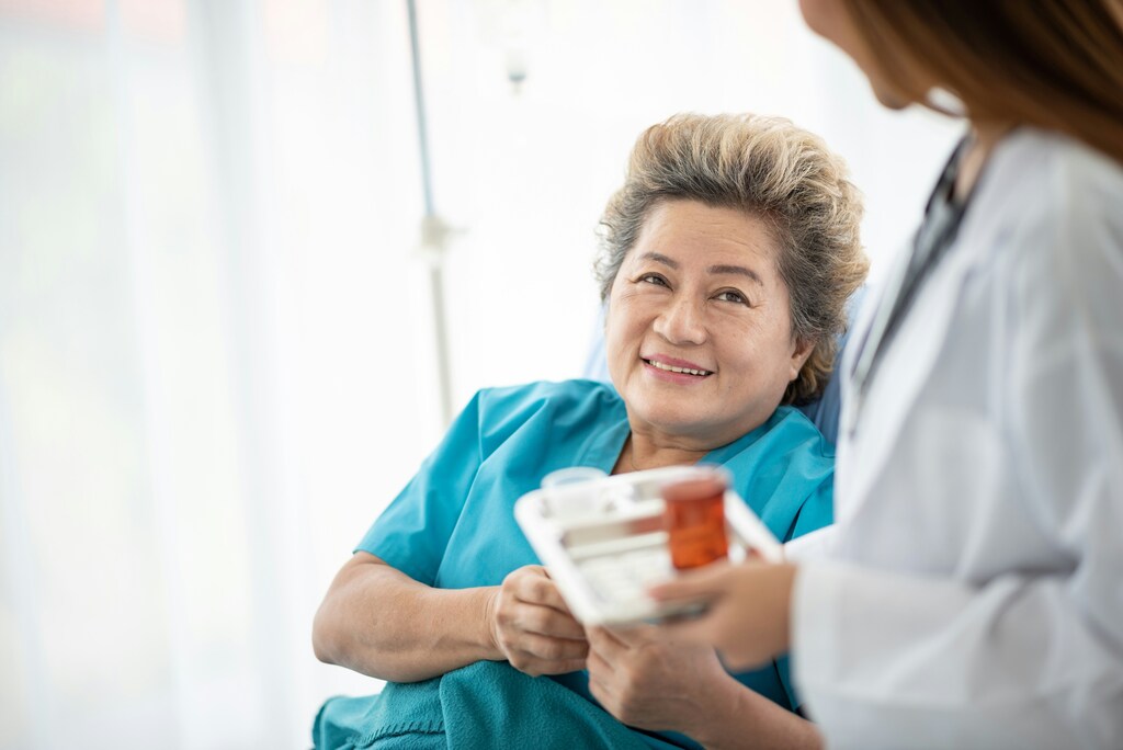 Doctor making sure her female patient takes her medication; sustainable health