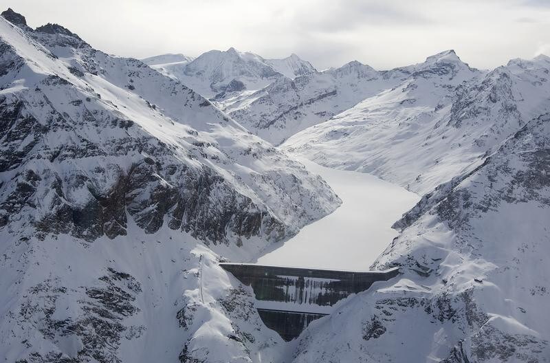 An aerial view shows the Grande Dixence dam in Pralong, Sion in this February 3, 2009 file photo. From the Himalayas to the Andes, faster-melting glaciers spell short-term opportunities -- and long-term risks -- for hydroelectric power and the engineering and construction industries it drives. The most widely used form of renewable energy globally, hydro meets more than half Switzerland's energy needs. As summers dry and glaciers that help drive turbines with meltwater recede, that share may eventually fall. Picture taken February 3, 2009. To match feature CLIMATE/GLACIERS-HYDRO REUTERS/Pascal Lauener/Files (SWITZERLAND ENVIRONMENT ENERGY) - GM1E5AM0NZK01