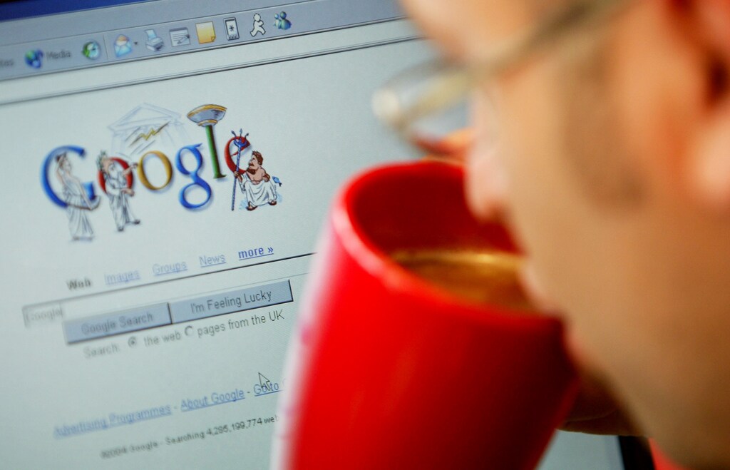 An internet surfer views the Google home page at a cafe in London, August 13, 2004.
