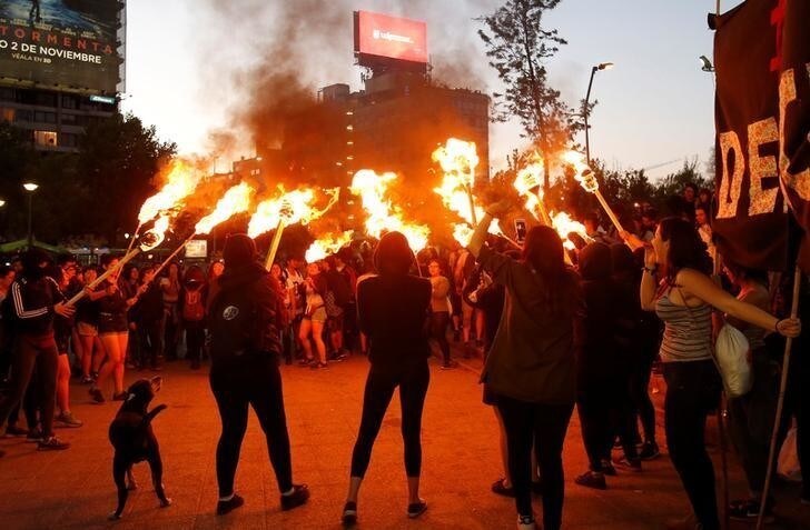 Members of feminist organisations take part in a rally against sexual harassment and gender violence in Santiago, Chile October 24, 2017. REUTERS/Carlos Vera