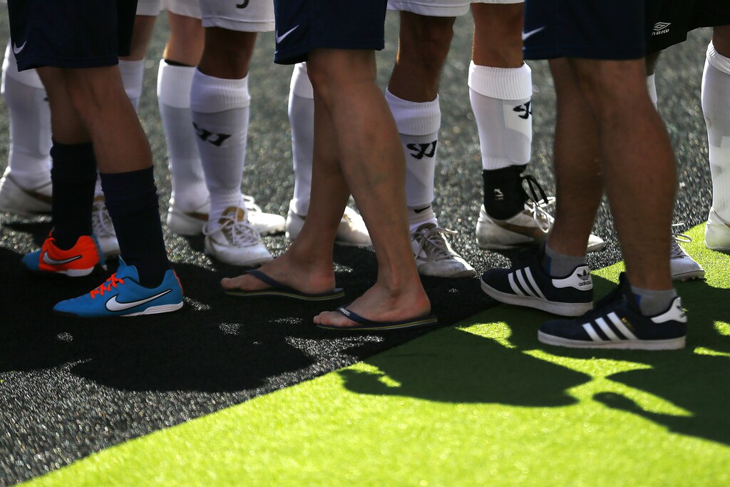 Players of Norway and Scotland greet before their soccer match at the 12th Homeless World Cup soccer tournament in Santiago October 19, 2014. Some 52 teams, including 12 women teams, took part in the tournament which start on Sunday until October 26th. Participants of the tournament are either asylum seekers, homeless or in drug or alcohol rehabilitation. REUTERS/Ivan Alvarado (CHILE - Tags: SPORT SOCCER SOCIETY) - RTR4ARAX